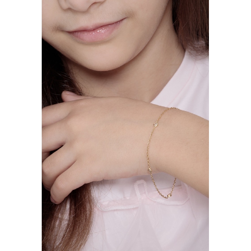 Pulsera fantasía para mujer en oro amarillo de 18 quilates con cuatro circonitas