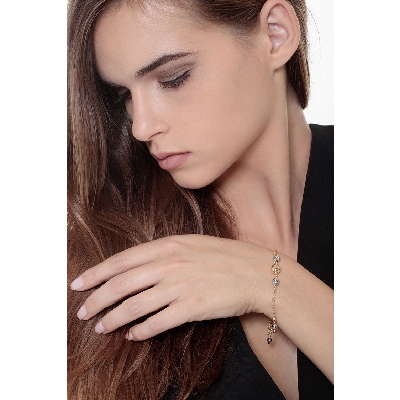 Pulsera en oro tricolor 18k con esferas diamantadas