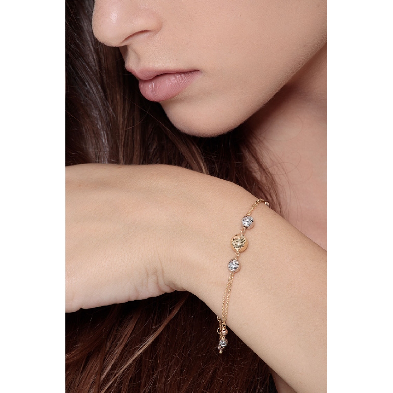 Pulsera en oro tricolor 18k con esferas diamantadas