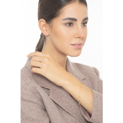 Brazalete en oro amarillo 18k con 7 charms redondos