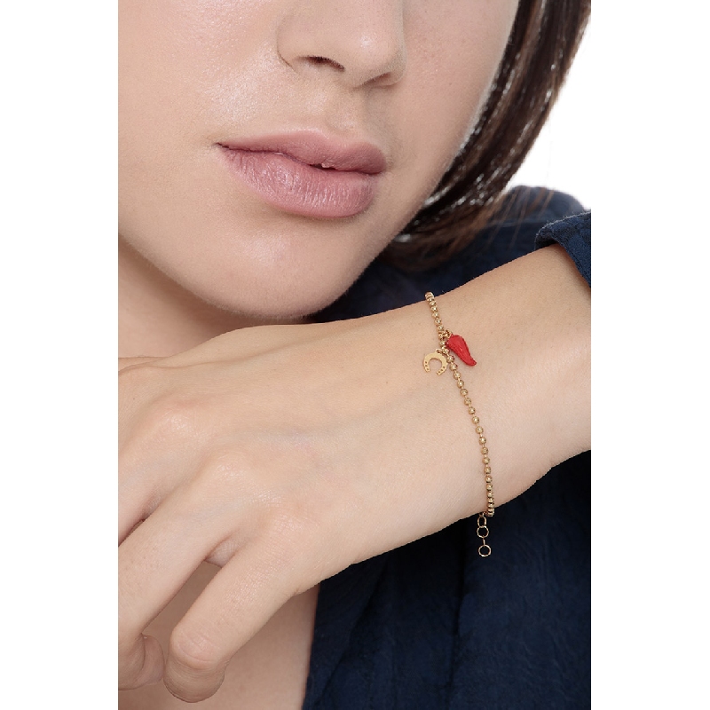 Pulsera oro 18K con herradura y cuerno rojo de la suerte