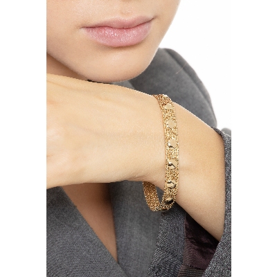 Brazalete de eslabones flexibles en oro amarillo y blanco de 18k
