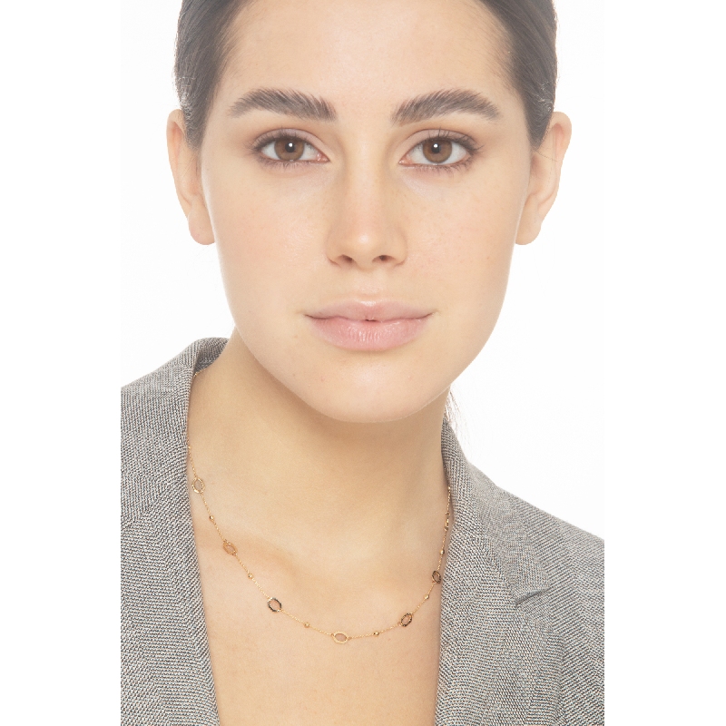 Collar en oro amarillo 18k con bolitas y aros  Collar en oro amarillo 18k con bolitas y aros