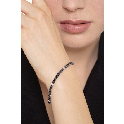 Pulsera de tenis en oro blanco 18k con diamantes negros alternados con diamantes 