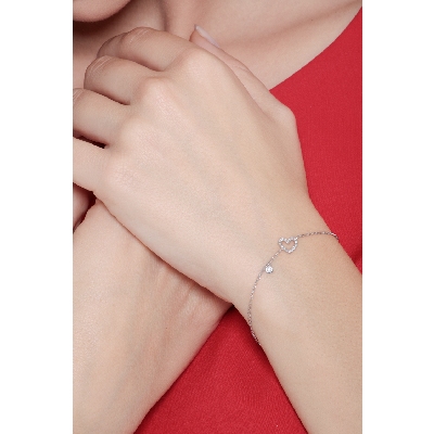 Pulsera en oro blanco 18k con corazón y diamantes