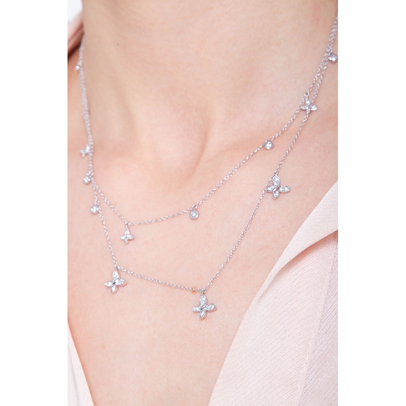 Collar doble hilo con colgantes laterales y mariposa en diamantes oro 750