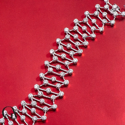 Pulsera en oro blanco 18k con engastes flexibles y diamantes