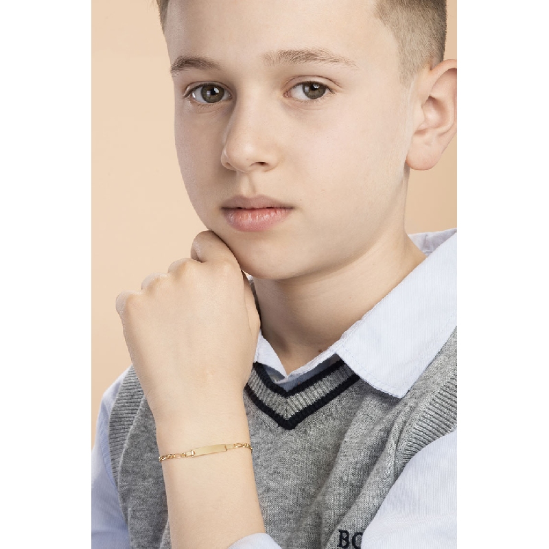 Pulsera infantil en oro amarillo de 18 quilates con placa