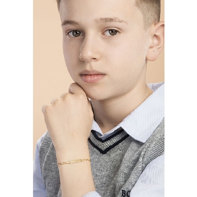 Pulsera infantil en oro amarillo de 18 quilates con placa