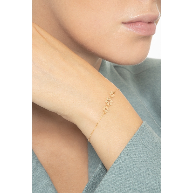 Pulsera en oro amarillo 18 quilates con tres flores  Pulsera en oro amarillo 18 quilates con tres flores