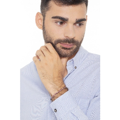 Pulsera tenis a garra en oro blanco 18k con rubíes y diamantes