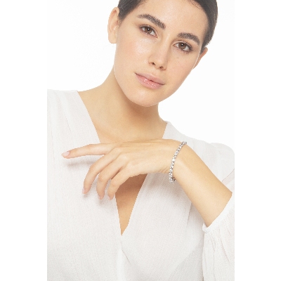 Pulsera tennis con garras en oro blanco  18k con diamantes