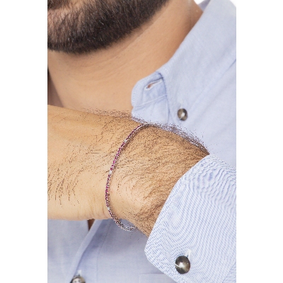 Pulsera tenis a garra en oro blanco 18k con rubíes y diamantes