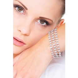 Pulsera en oro blanco 18k con eslabones de tres engastes y diamantes 2