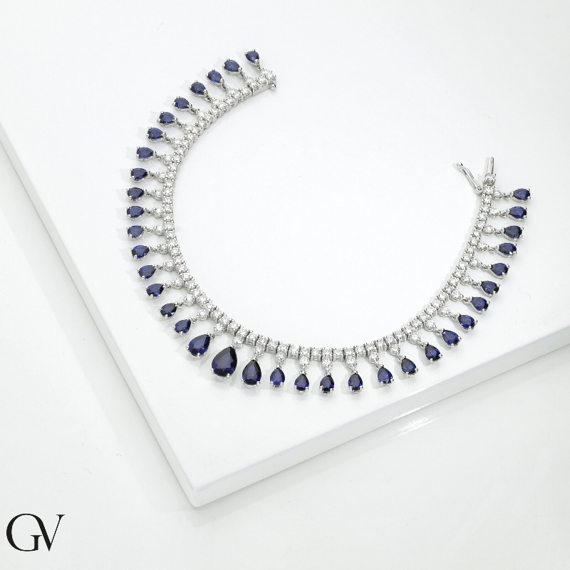 Brazalete fantasia en oro blanco 750 con zafiros azules y diamantes Brazalete fantasia en oro blanco 750 con zafiros azules y diamantes