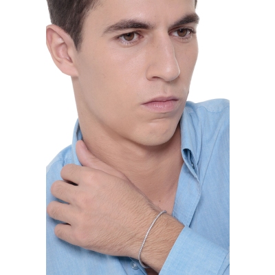 Brazalete tenis con garras en oro blanco 18k con diamantes