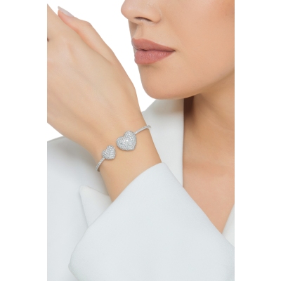 Brazalete en oro blanco 18k con dos corazones de diamantes