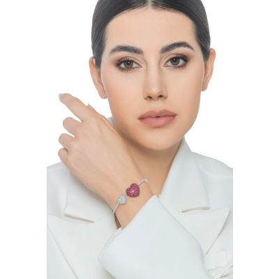 Brazalete en oro blanco 18k con dos corazones en rubíes y diamantes