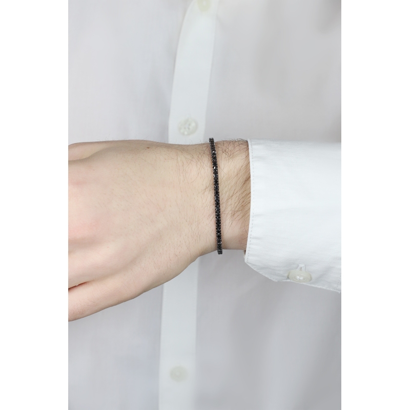 Brazalete tennis en oro blanco de 18 quilates con diamantes negros sobre oro ennegrecido