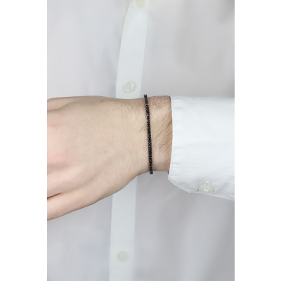 Brazalete tennis en oro blanco de 18 quilates con diamantes negros sobre oro ennegrecido