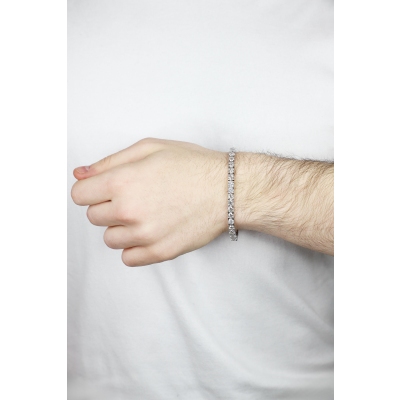 Pulsera tennis con garras en oro blanco  18k con diamantes