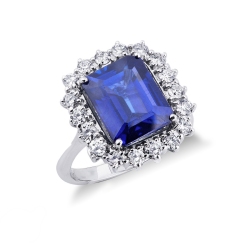 Anillo en oro blanco 18k con zafiro azul rodeado de diamantes