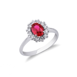 Anillo con rubí oval y halo de diamantes en oro de 18 kilates