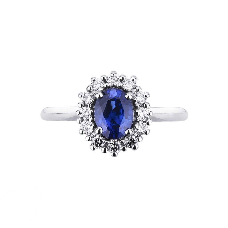 Anillo con zafiro oval central y halo de diamantes en oro blanco de 18 kilates Anillo con zafiro oval central y halo de diamantes en oro blanco de 18 kilates