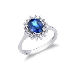 Anillo de oro blanco de 18 kilates con zafiro azul central y halo de diamantes