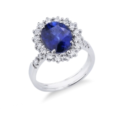 Anillo contorno en oro blanco de 18k con zafiro azul y diamantes