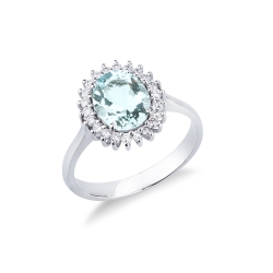 Anillo en oro blanco de 18k con una aguamarina ovalada halo diamantes