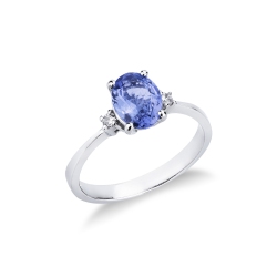 Anillo en oro blanco de 18 quilates con 2 diamantes y una tanzanita en el centro