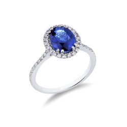 Anillo en oro blanco con zafiro azul ovalado y diamantes