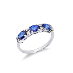 Anillo de mujer en oro blanco 18k con zafiros azules y diamantes