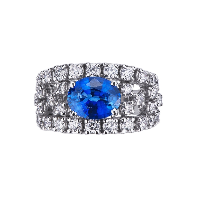 Anillo oro blanco de 18k con zafiro azul central corte ovalado Anillo oro blanco de 18k con zafiro azul central corte ovalado