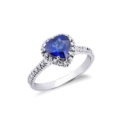 Anillo con zafiro azul en forma de corazón engastado con diamantes oro blanco 18 kilates