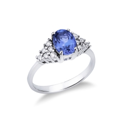 Anillo de oro blanco de 18k con tanzanita y 6 diamantes a cada lado