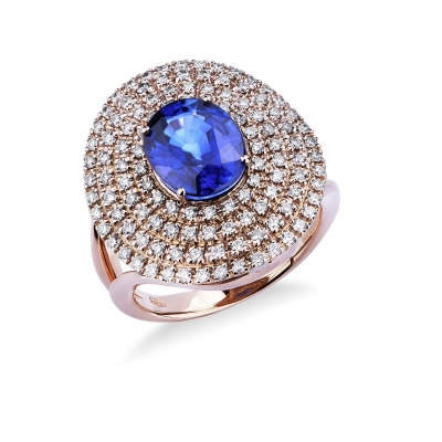 Anillo halo en oro rosa de 18k con zafiros azules y diamantes