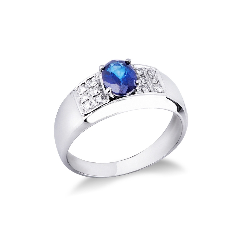 Anillo en oro blanco 18k con zafiro azul ovalado y diamantes Anillo en oro blanco 18k con zafiro azul ovalado y diamantes