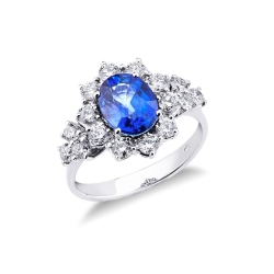 Anillo de mujer en oro blanco de 18k con zafiro azul