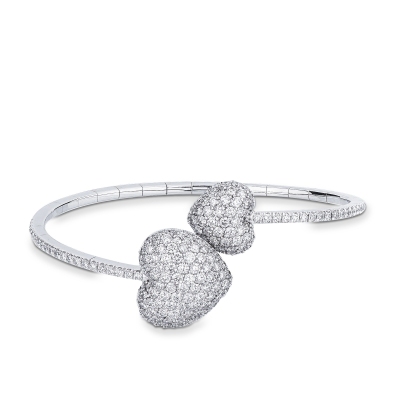 Pulsera de oro blanco 18 qt con dos corazones de diamantes