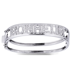 Brazalete rígido con la inscripción BONHEUR en oro blanco de 18k