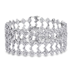 Pulsera en oro blanco 18k con eslabones de tres engastes y diamantes