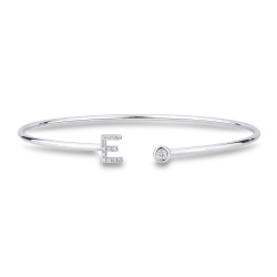 Pulsera rigida de oro con letra E en diamantes
