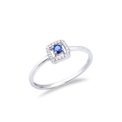 Anillo de oro blanco de 18 quilates con zafiro azul central y halo de diamantes