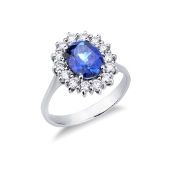 Anillo en oro blanco de 18k con zafiro azul ovalado con diamantes