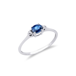 Anillo oro blanco de 18 quilates con un zafiro azul
