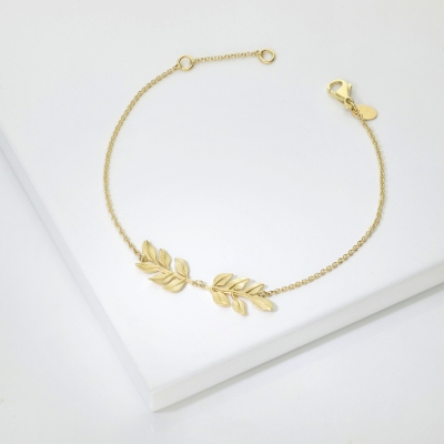 Pulsera de oro amarillo 18k con dos hojas