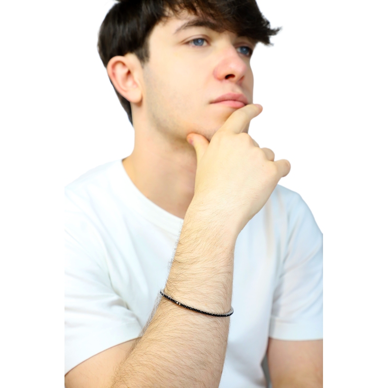 Pulsera tennis elastica con diamantes negros en oro blanco 750