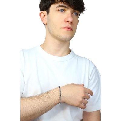 Pulsera tennis elástica con diamantes negros en oro blanco 750